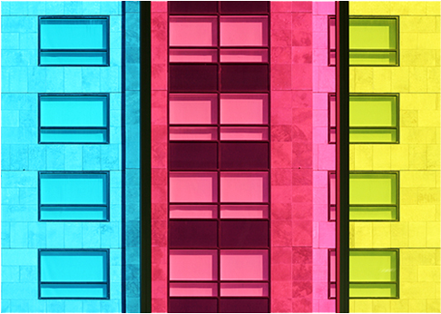 Colourful photograph in turquoise, pink and yellow showing exterior of Palais de Congres building in Montreal, Canada