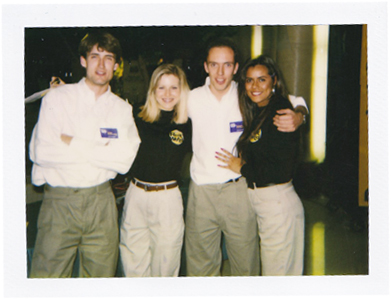 Two male field managers and two female staff working on the 1994 Panasonic Real World Mall Tour for the 3DO multiplayer